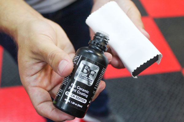 After you've prepped your paint surface, put 3-5 drops of BLACKFIRE Pro Ceramic Paint Coating Black Edition on a suede towel wrapped around a coating block.